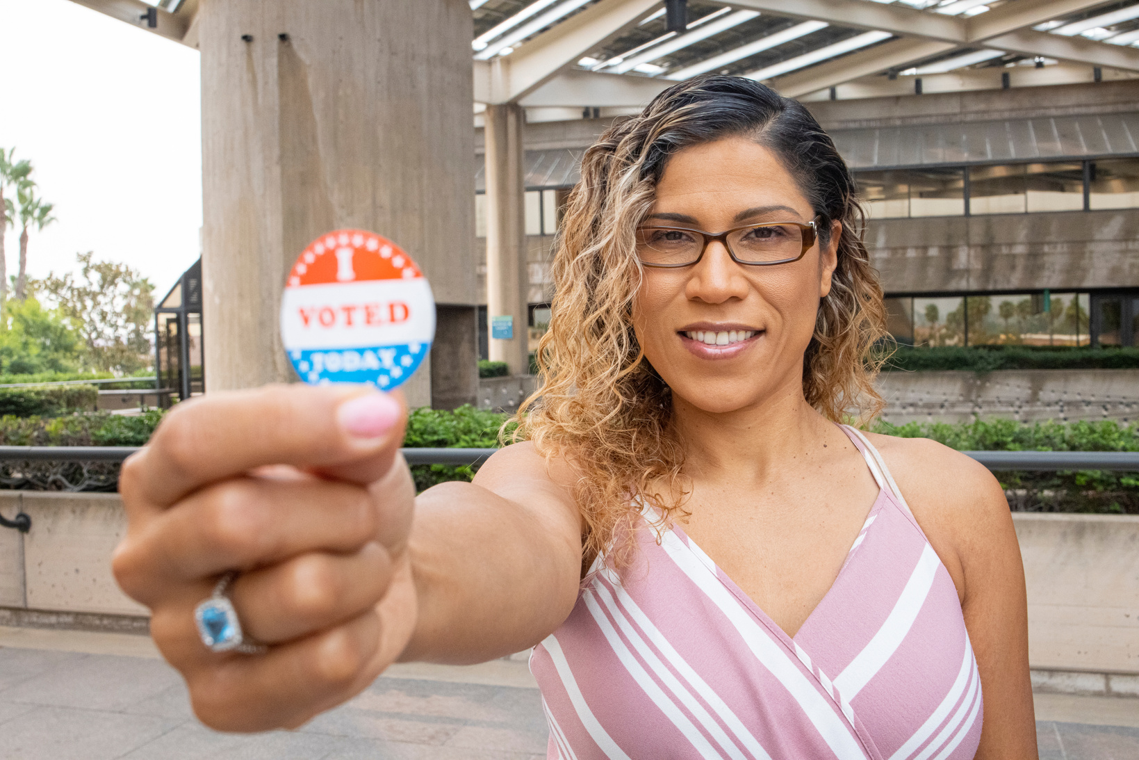 Young Hispanic Woman with I voted Sticker